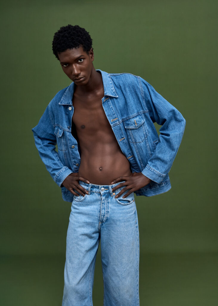 a black model wearing blue jeans